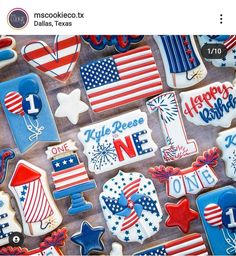 patriotic decorated cookies are displayed on a table