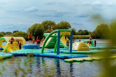 there are many inflatable water slides on the lake