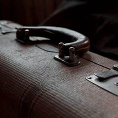 a piece of luggage sitting on top of a bed