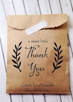 a brown paper bag with the words thank you on it