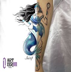 a woman with a blue and white tattoo on her arm