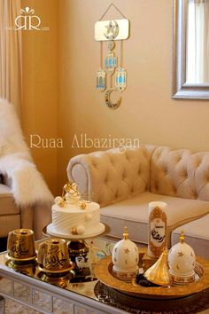 a living room filled with furniture and a table topped with a cake covered in white frosting