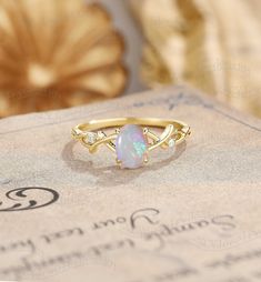 Twisted Opal Engagement Ring, Oval Cut Opal Ring Yellow Gold, Vine Opal Ring, Vintage Twig Ring Ring#:NC1048 Center stone: Opal oval cut 5*7mm Side stones: moissanite Shape: Round cut Size/weight:1.3mm Custom orders are most welcome! Please feel free to ask for any item, any adjustments or anything else you want me to make. Rush order Orders can be expedited for a fee. If your order needs to be expedited, please contact us ASAP. Layaway plan We offer layaway plan that works with a $100 as the fi Simple Opal Engagement Ring, Oval Cabochon Opal Ring With Accent Stones For Anniversary, Oval Opal Ring For Anniversary, Oval Opal Gemstone Rings, Heirloom Oval Opal Ring With Accent Stones, Heirloom Oval Opal Ring For Anniversary, Oval Cabochon Opal Ring For Anniversary, Opal Oval Diamond Ring With Gemstone, Opal Birthstone Ring Oval Cabochon For Anniversary