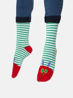 "One Sunday morning the warm sun came up and - pop! - out of the egg came a tiny and very hungry caterpillar." Product Details Unisex 75% cotton, 20% polyester, 5% spandex Size & Fit Small: Shoe Sizes: 5.5-9/Sock: 9-11 Large: Shoe Sizes: 8.5-12/Sock: 10-13 Each purchase helps to fund literacy programs and book donations to communities in need. Red Cotton Socks For Spring, Playful Green Socks For Stocking Stuffers, Cute Green Socks For Spring, Cute Green Socks For Stocking Stuffers, Playful Multicolor Cotton Socks, Playful Green Winter Socks, Playful Red Cotton Socks, Fun Cotton Winter Socks, Fun Green Cotton Socks