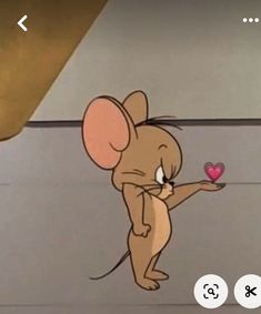 a cartoon mouse holding a heart shaped object