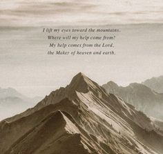 a mountain with a poem written in the middle on it's side next to mountains