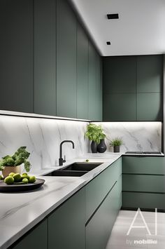 a kitchen with green cabinets and marble counter tops, along with a bowl of broccoli