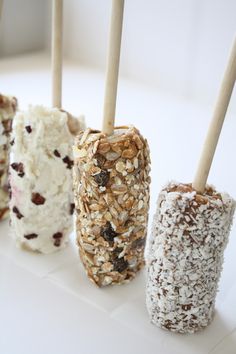 four different kinds of food on sticks