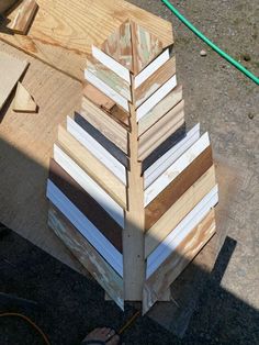 several pieces of wood stacked on top of each other in the shape of a christmas tree