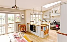 the kitchen is clean and ready to be used as a family room or dining area