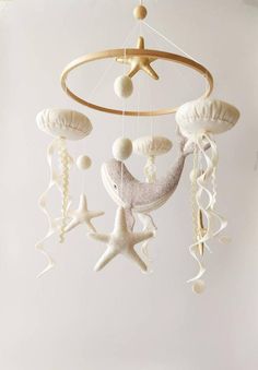 a mobile with shells and stars hanging from it