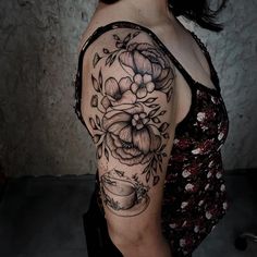 a woman with a tattoo on her arm