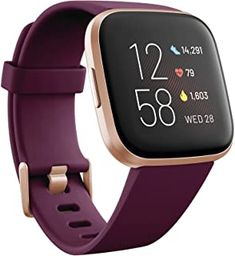 the fitbit smart watch is shown in purple