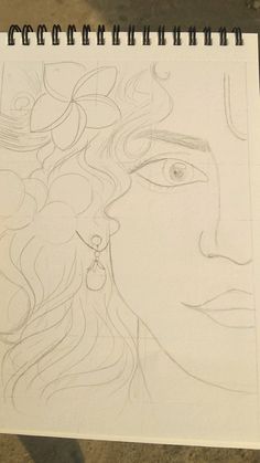 a drawing of a woman's face with long hair and earrings on her head