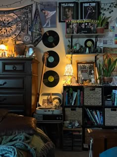 a bedroom with lots of records on the wall