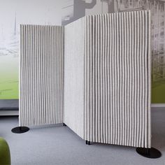 a room divider made out of pleated fabric