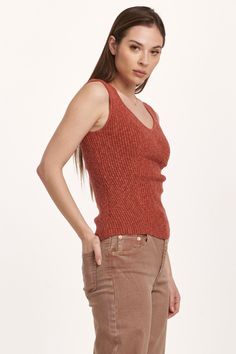 Decollete neck tank, verigated stretch rib finished with edge hem. Soft, cozy, versatile rib tee, the perfect blend for your lifestyle... Solid color knit fitted.Body length from HPS: 22 1/2", Sleeve length: N/A, Bust: 27" (Size Small) 58% COTTON 35% VISCOSE 7% SPANDEX Hand wash cold, Reshape dry flat Imported Sleeveless Ribbed Top For Layering, Sleeveless Tops With Ribbing For Layering, Everyday Ribbed V-neck Knit Top, Knit Tank Top For Layering With Ribbed Neckline, Ribbed Knit Tank Top For Layering, Tank Top For Layering In Fall, Fitted Ribbed Sweater Vest For Layering, Fall Layering Tank Top, Seamless Tank Top For Layering In Fall