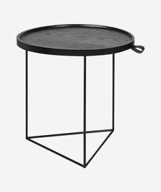 a round table with black metal frame and wood top