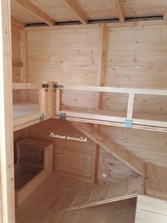 the inside of a chicken coop with wooden walls