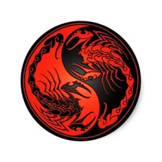 a red and black dragon symbol on a white background