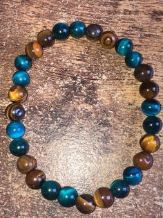 Blue and Brown Tigers Eye Bracelet 8mm Blue Eye Bracelet, Tigers Eye Bracelet, Brown Tiger Eye, Trending Bracelets, Brown Bracelet, Online Closet, Tiger Eye Bracelet, Aqua Marine, Blue And Brown