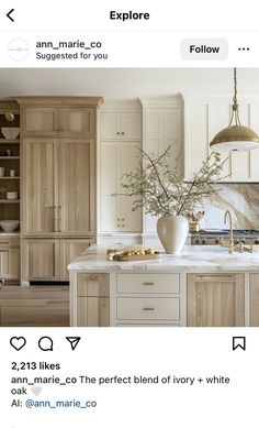 a kitchen with white cabinets and marble counter tops on instagram for an article about how to use it