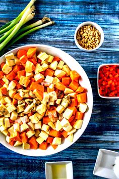 a bowl filled with chopped up vegetables next to other ingredients