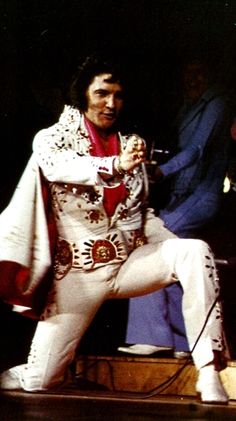 elvis presley performing on stage at an event