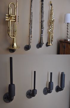 there are several different types of musical instruments on the wall, and one is black