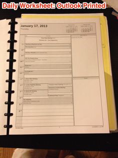 the daily worksheet outlook printed on a binder