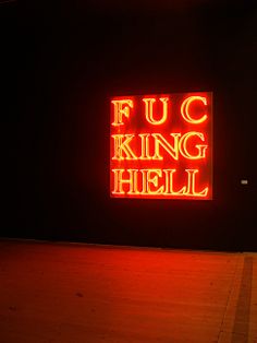 a neon sign that reads fuc king hell