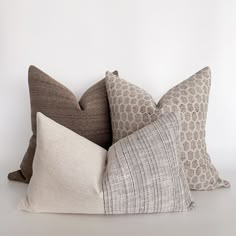 four pillows stacked on top of each other