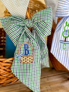 two green and white gingham bags with monogrammed bows