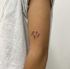 a person with a small tattoo on their arm