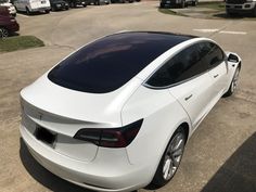 a white car parked in a parking lot