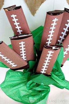 some paper rolls with footballs on them