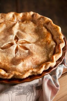 a pie sitting on top of a wooden table