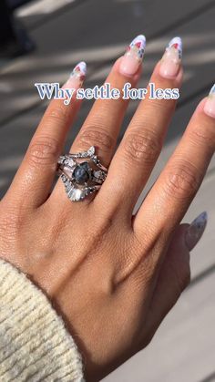 a woman's hand with two rings on it and the words why suitele for less