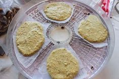 four cookies sitting on top of a glass plate