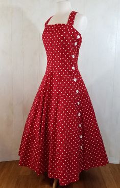 "A relatively newer vintage dress by Robbie Bee who began his carrer in the 1980's. I just love this little dress so much I think if it was made yesterday I would offer it at my store. It would be perfect for the fourth of July.  Crisp cotton polka dot that screams vintage. It buttons down the side and criss crosses in the back.  Fabric and dress are five star perfect condition!   All my dresses are hand washed or dry cleaned prior to selling. If a dress has been repaired anywhere I will make note of it in the description. Thank you taking a peek at Pink Leaf Vintage. Little Notes Bust 34\" Waist  28\" length from waist to hem 30\"" Vintage Fitted A-line Tea Length Dress, 1950s Vintage Pattern Dress For Vintage Fashion, Fitted Vintage Dress For Retro-themed Summer Events, Vintage Cotton Dresses With Vintage Pattern, Lined Retro Vintage Dress, Vintage Cotton Party Dress, 1950s Style Knee-length Lined Dress, Cotton Vintage Dress For Party, Vintage Midi Length Dresses For Vintage Fashion