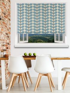 an image of a dining room setting with white chairs and brick wall in the background