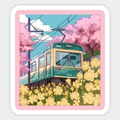 a green and yellow train traveling down tracks next to trees with pink flowers on them