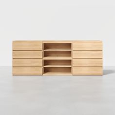 the sideboard is made out of wood and has two open shelves on one side