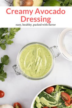 creamy avocado dressing in a bowl with tomatoes, lettuce and other vegetables