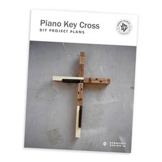 a wooden cross with the words piano key cross on it