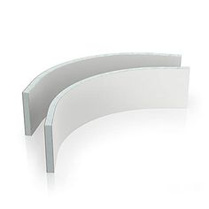 a curved white shelf sitting on top of a table