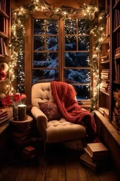 a chair with a blanket on it in front of a window filled with christmas lights