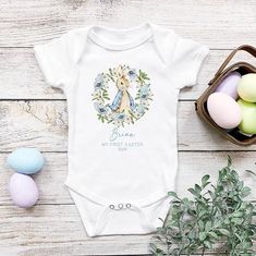 Make your little one the star of the Easter egg hunt with this rabbit-inspired baby grow. The perfect outfit for their first Easter celebrations! 🐇 #Easterbabyoutfit #babygrowboy #babygiftidea #rabbittheme #1stEaster  #EtsyUk #HoolarooUK Blue Vest Outfit, Baby Easter Outfit, Vest Outfit, Easter Baby, Blue Vest