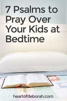 an open book sitting on top of a bed with the words 7 ways to pray over your kids at bedtime