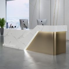 a white and gold reception desk in an office with two computers on the counter top